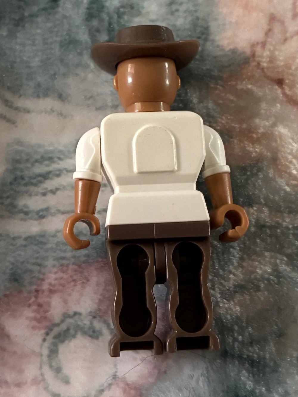 Brown and White Cowboy Figure Mini Toy